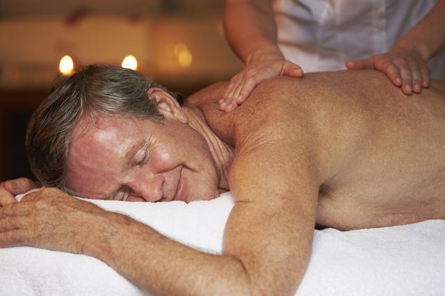 Mature man receiving massage therapy